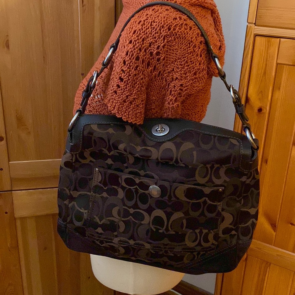 Coach Brown signature, leather handle & Suede bottom.